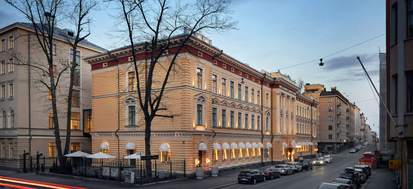 Joined nineteenth-century house fronts along a quiet city block.