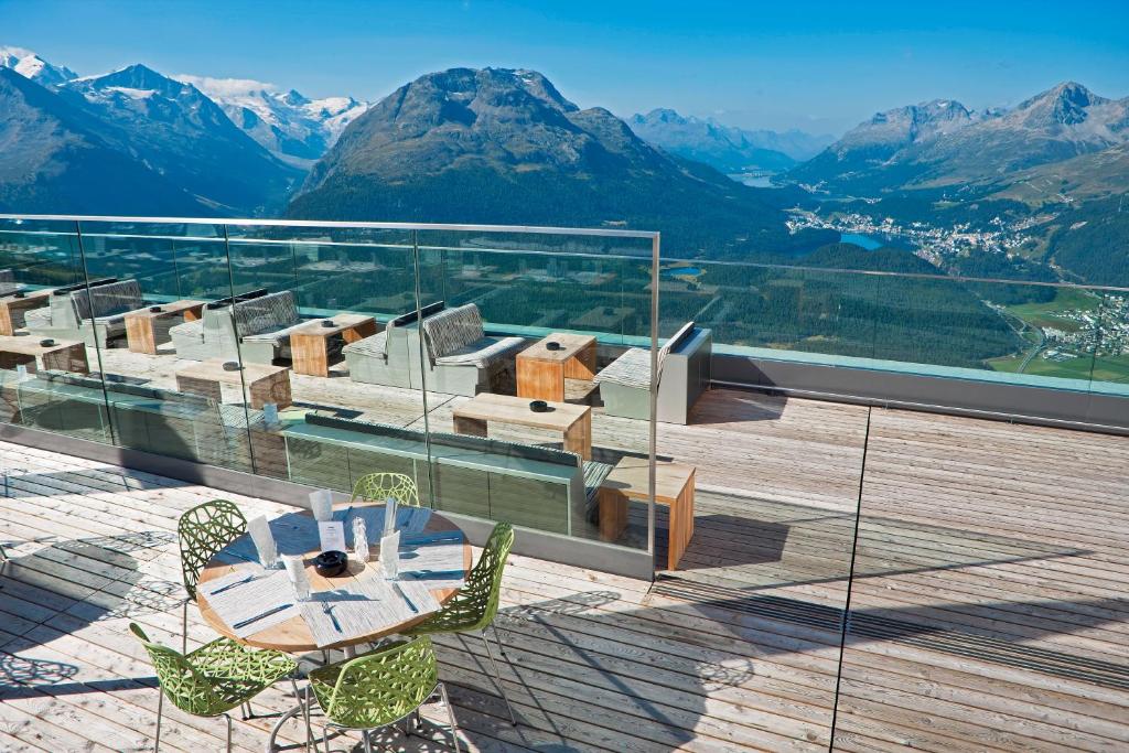 A mountain hotel on a shoulder above a valley of lakes.